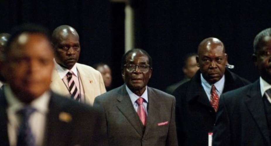 Zimbabwean President  Robert Mugabe C attends a Southern African Development Community SADC Extraordinary Summit.  By Alexander Joe AFPFile