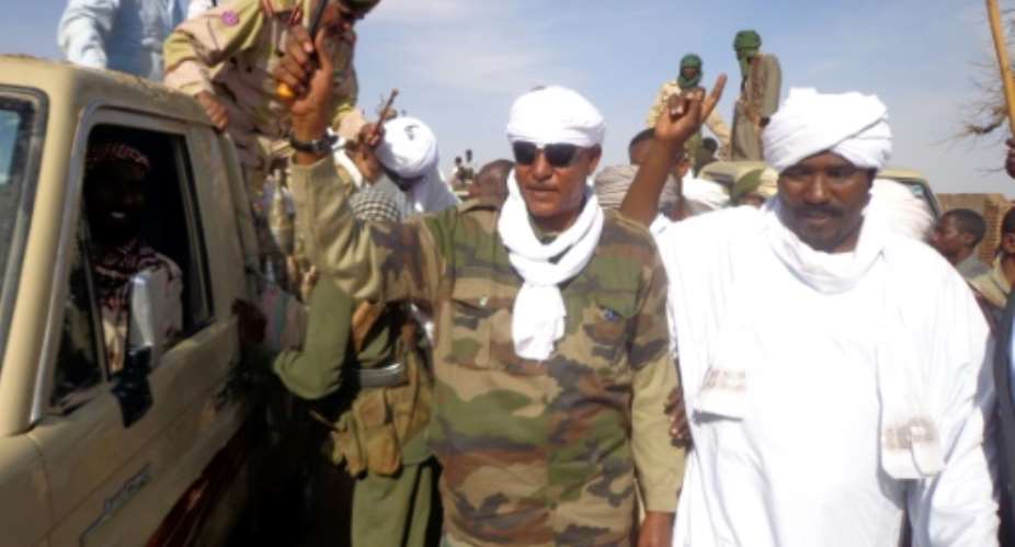 Musa Hilal C, the leader of the Arab Mahamid tribe in Sudan's Darfur region, salutes followers in Nyala, the capital of South Darfur state, on December 7, 2013.  By - AFPFile