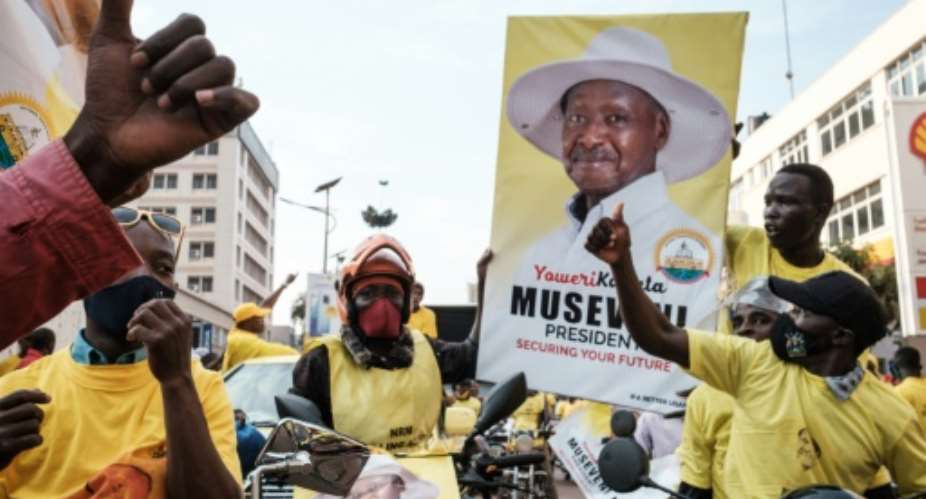 Museveni supporters in Kampala celebrated after his victory was announced on Saturday.  By Yasuyoshi CHIBA AFP
