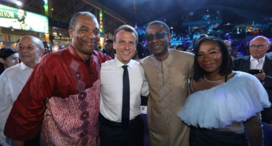 Musician Femi Kuti left is seen here posing recently in Lagos next to French president Emmanuel Macron and Senegalese singer Youssou N'dour second right.  By Ludovic MARIN POOLAFPFile