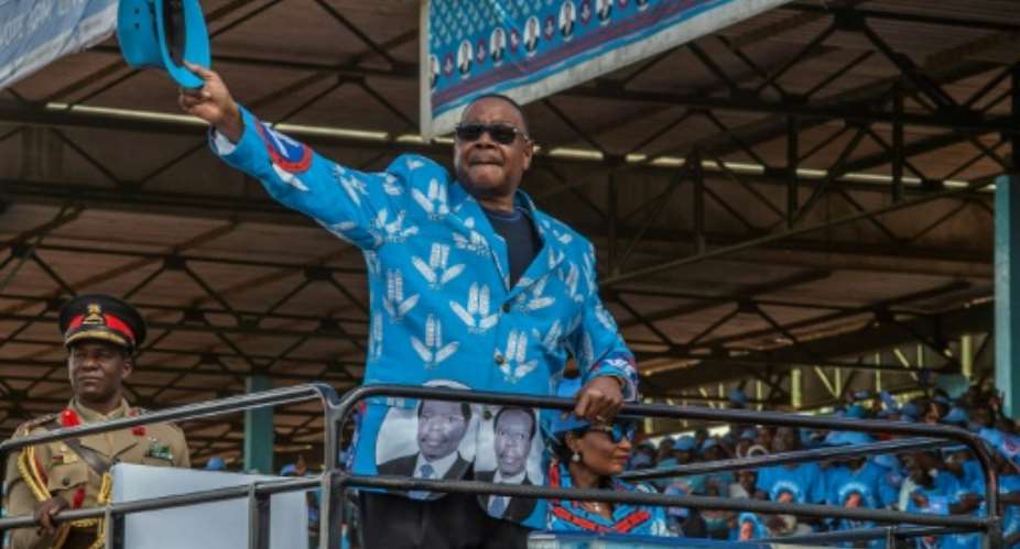 Mutharika salutes the crowd at the launch of his party manifesto in April.  By AMOS GUMULIRA AFPFile