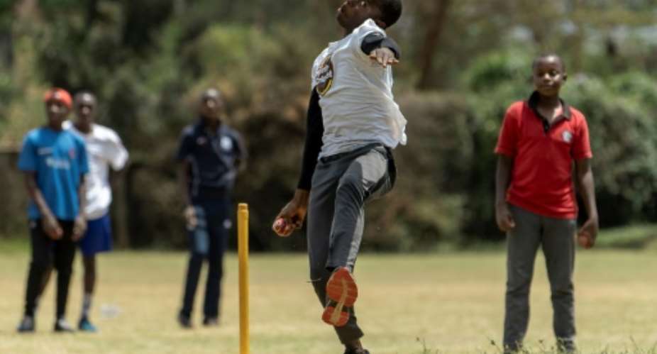 'My dream is to play for Kenya': Ken Mwangi bowls during a training session at the Obuya Cricket Academy.  By Tony KARUMBA AFP