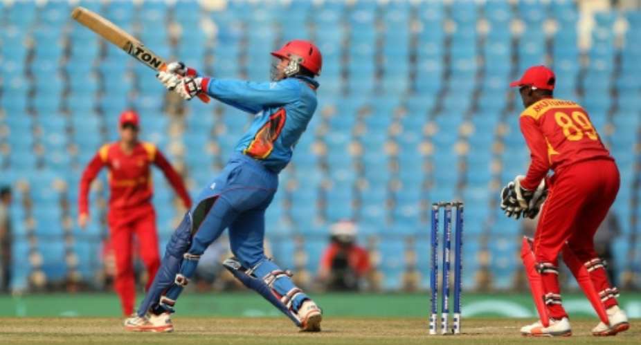 Afghanistan's Mohammad Nabi goes on the attack against Zimbabwe in their World Twenty20 match in Nagpur on March 12, 2016.  By Prashant Bhoot AFP