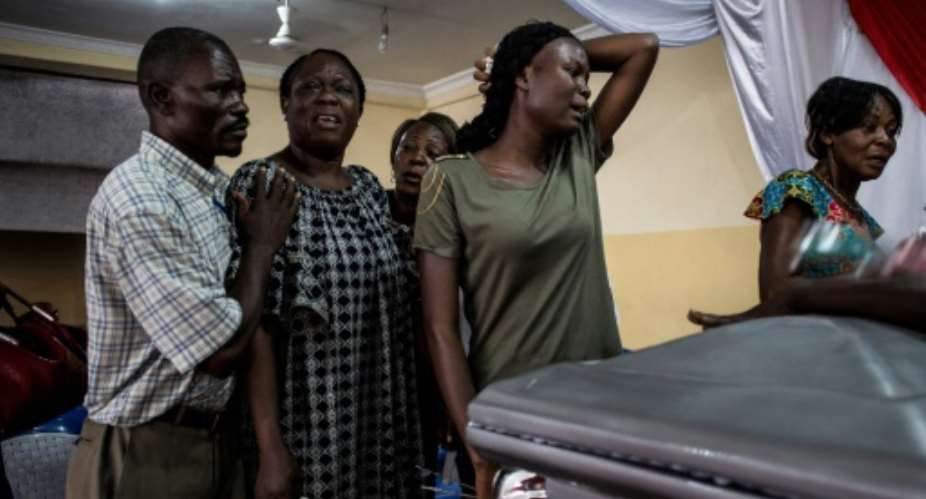 Natural disaster, illness and political unrest came together at the turn of the year to take a tragic toll in Kinshasa, at great expense to grieving families.  By JOHN WESSELS AFPFile