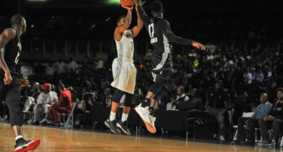NBA player Kyle Lowry (L) shoots during the NBA Africa Game 2017 basketball match between Team Africa and Team World on August 5, 2017 in Johannesburg.  By MUJAHID SAFODIEN (AFP)