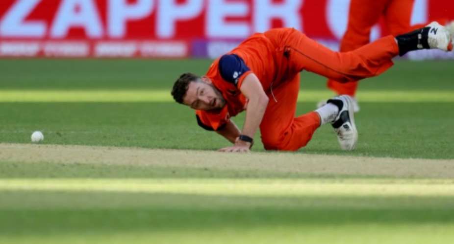 Netherlands' Paul van Meekeren dives to field the ball against Zimbabwe.  By Trevor Collens AFP