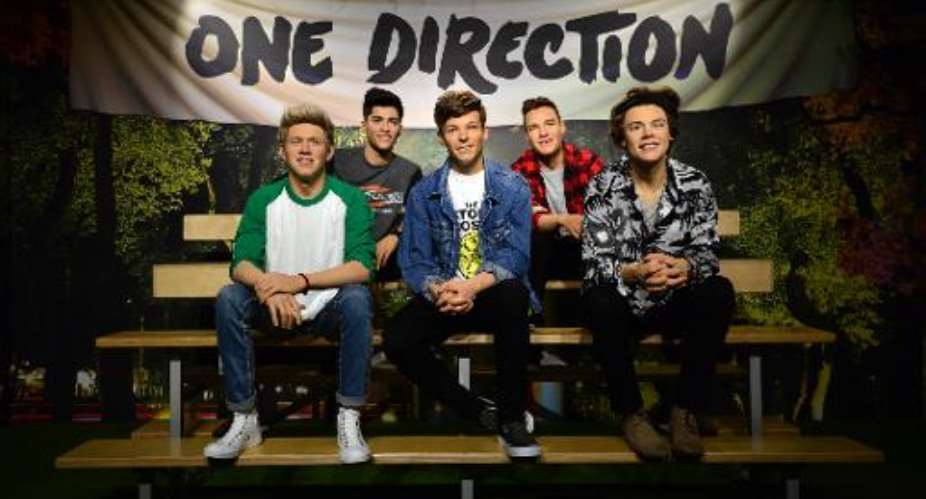 Madame Tussauds waxwork figures of One Direction, who will appear on the new Band Aid single.  By Carl Court AFP