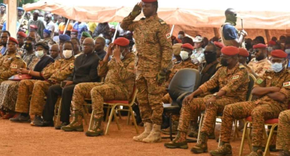 New junta leader Captain Ibrahim Traore C attends the October 8 funerals of 27 soldiers killed in an attack symbolising Burkina Faso's security troubles.  By Issouf SANOGO AFP