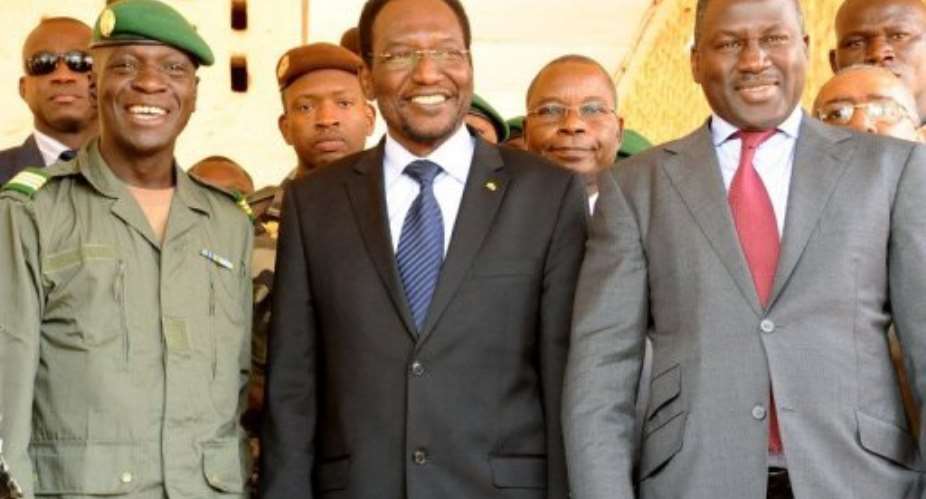 Mali's interim president Dioncounda Traor centre, pictured with coup leader Captain Amadou Sanogo left.  By Habibou Kouyate AFP