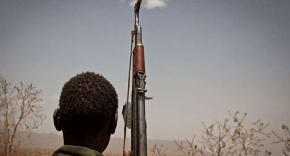 A Sudan Peoples Liberation Movement rebel soldier looks out toward Talodi, in South Kordofan on April 25.  By Adriane Ohanesian (AFP/File)