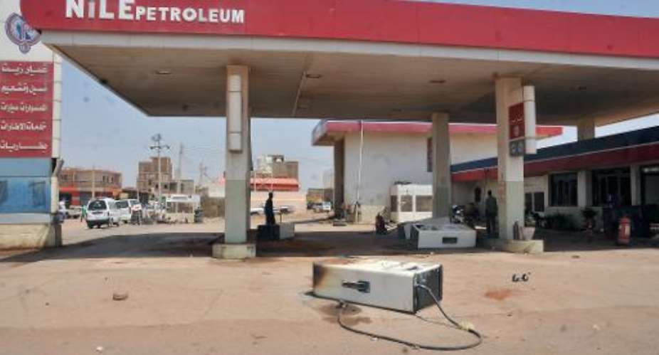 A picture taken on September 26, 2013 in the Sudanese capital shows a petrol station that was damaged during rioting following a decision of the government to scrap fuel subsidies.  By  AFPFile