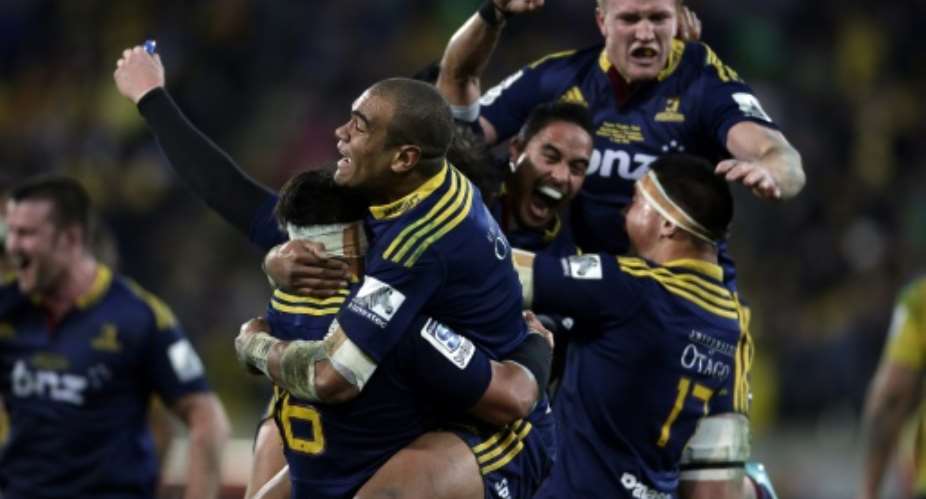 Otago Highlanders players celebrate winning the Super 15 rugby union final against the Wellington Hurricanes in Wellington on July 4, 2015.  By Anthony Phelps AFPFile
