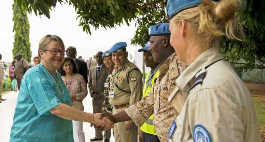 New UNMISS mission head Ellen Margrethe Loj L is greeted by UNMISS personnel as she arrives in Juba on September 2, 2014.  By J Mcilwaine UNMISSAFP