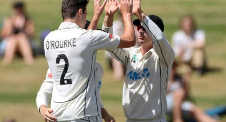 New Zealand debutant Will O'Rourke left celebrates his first wicket in Test cricket.  By Fiona Goodall AFP