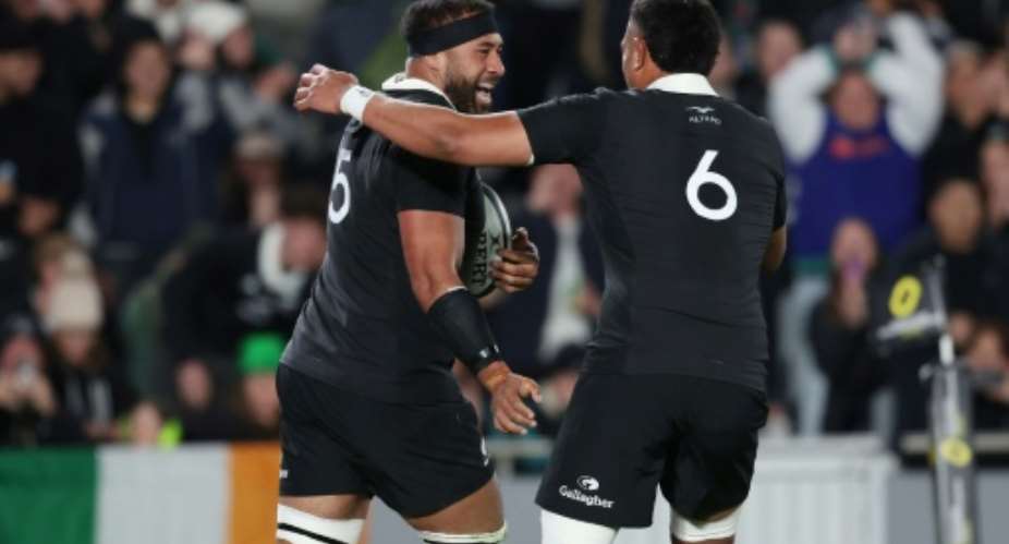 New Zealand lock Patrick Tuipulotu (L) celebrates his try against Ireland in a 2026 Nations Championship match during July.  By Michael Bradley (AFP)