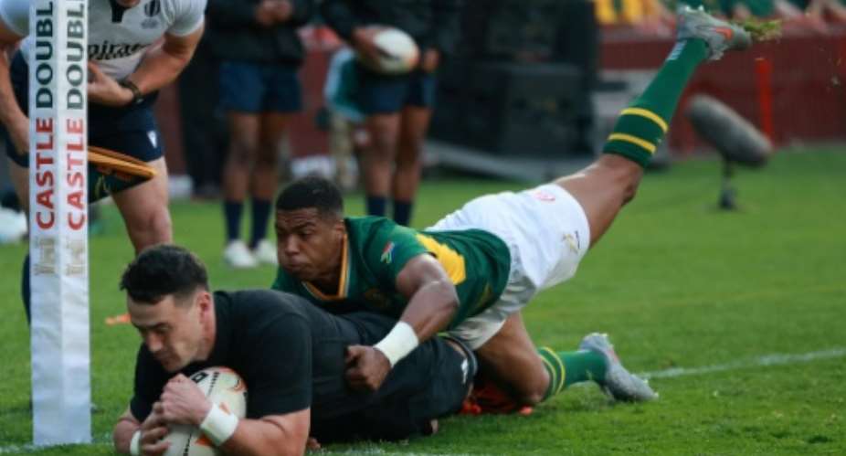 New Zealand wing Will Jordan scores his first try against South Africa in Johannesburg.  By PHILL MAGAKOE (AFP)
