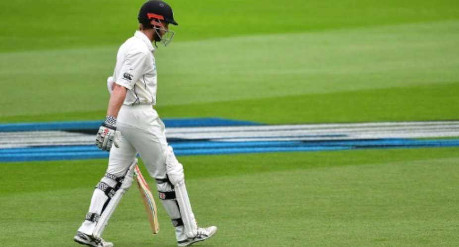 New Zealand's captain Kane Williamson walks from the field after being caught on day three of their 2nd Test match against South Africa, at the Basin Reserve in Wellington, on March 18, 2017.  By Marty Melville AFP