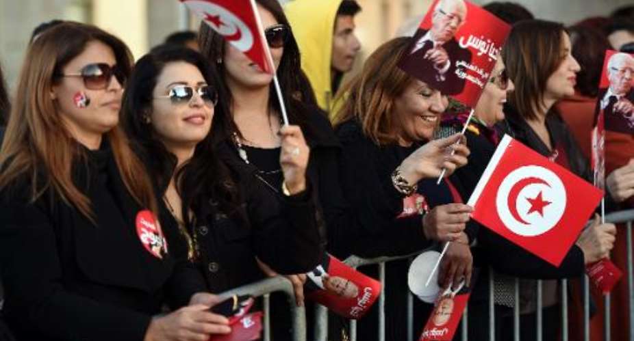Supporters of newly-elected President Beji Caid Essebsi celebrate after his victory on December 22, 2014 in Tunis.  By Fethi Belaid AFPFile
