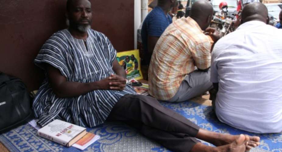 Nicodeme Ayao Habia, pictured on September 29, had been staging a hunger strike in front of the Ghanaian embassy in Lome.  By Matteo FRASCHINI KOFFI AFPFile