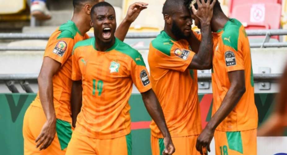 Nicolas Pepe 2nd L and his Ivory Coast teammates celebrate after Franck Kessie put them ahead against Algeria.  By CHARLY TRIBALLEAU AFP
