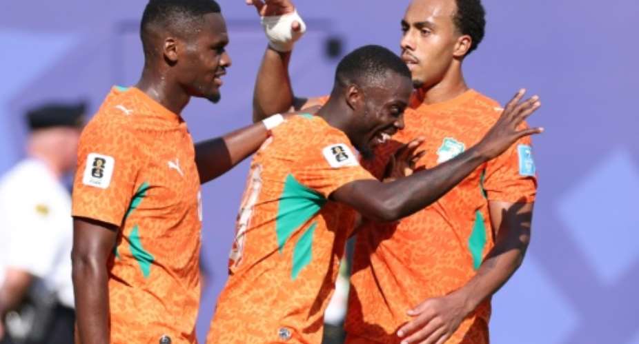 Nicolas Pepe (C) celebrates with teammates after scoring one of his two goals for Ivory Coast in their win against Curacao on Thursday.  By Kevin C. Cox (GETTY IMAGES NORTH AMERICA/AFP)