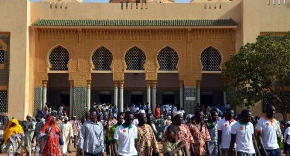 People leave the Grand Mosque of Niamey, Niger on May 1, 2015, after a prayer for the victims of an attack by Boko Haram Islamists on Karamga island on Lake Chad.  By Boureima Hama AFPFile