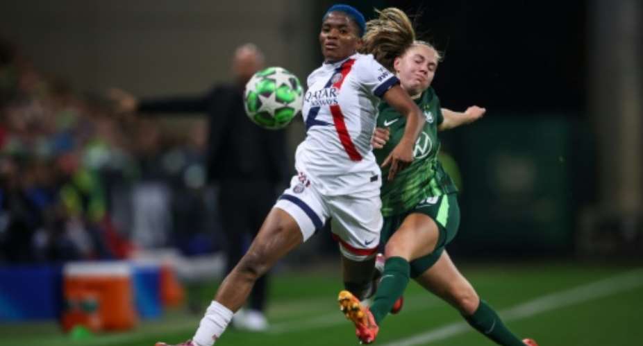 Nigeria captain Rasheedat Ajibade (L) playing for Paris Saint-Germain in the UEFA Womens Champions League.  By RONNY HARTMANN (AFP)