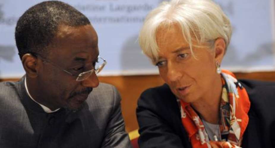 IMF Managing Director Christine Lagarde right talks with Lamido Sanusi at a meeting in Lagos on December 20, 2011.  By Pius Utomi Ekpei AFP