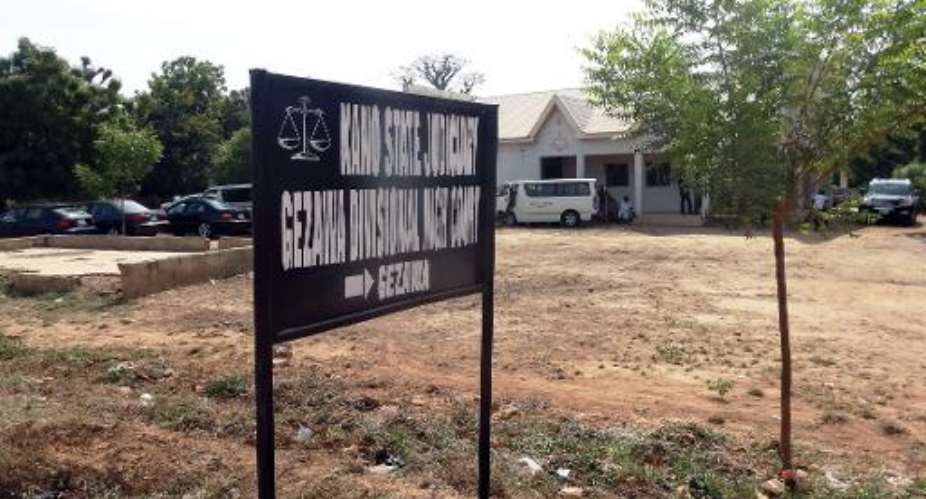 A signpost points to the Kano state High court in the village of Gezawa outside Kano, where 14-year old Wasila Tasi'u is standing trial for the murder of her husband.  By Aminu Abubakar AFPFile