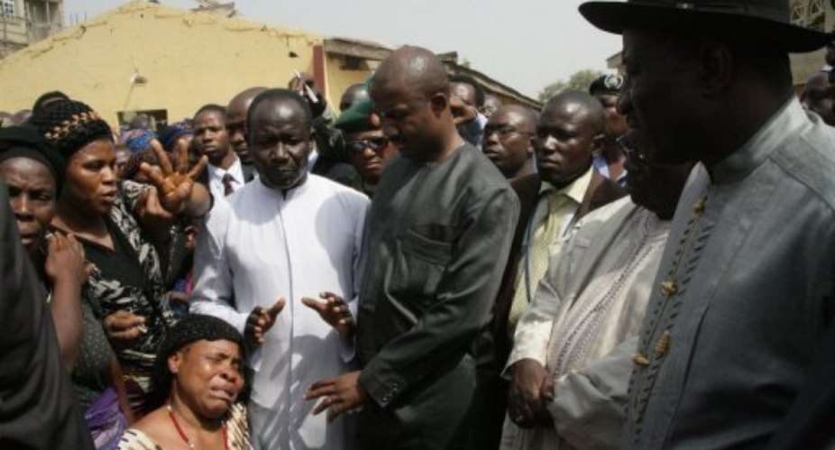 President Goodluck Jonathan visits the church where  44 people were killed while leaving a mass on Christmas Day.  By Wole Emmanuel. (AFP)