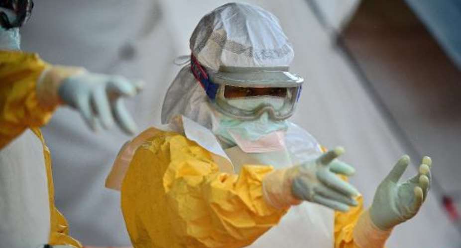 A medical worker from French NGO Doctors Without Borders wears protective clothing at an Ebola treatment facility in Kailahun, Sierra Leone, on August 15, 2014.  By Carl de Souza AFPFile