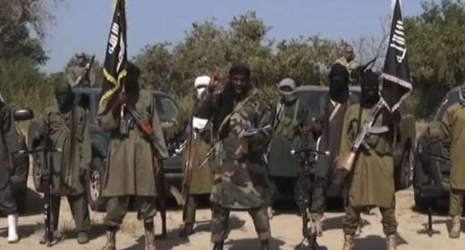An image grab made on October 31, 2014 from a video from Islamist extremist group Boko Haram shows the group's leader Abubakar Shekau C delivering a speech.  By  Boko HaramAFPFile