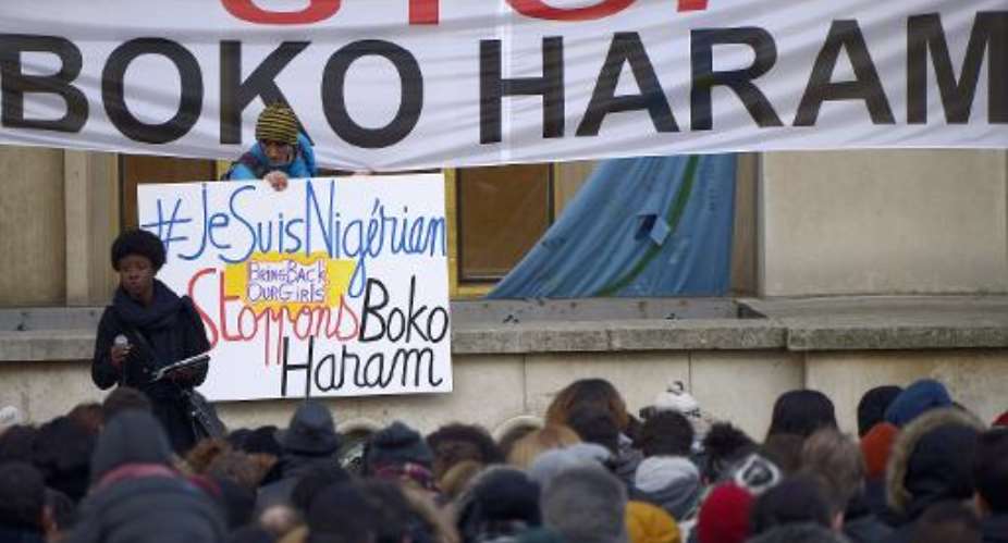 Demonstrators holds placards and banners reading I am Nigerian L and Stop Boko Haram in Paris on January 18, 2015 to protest against Boko Haram islamists.  By Lionel Bonaventure AFPFile