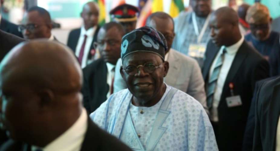 Nigeria President Bola Ahmed Tinubu, centre, said the use of force against Niger's coup leaders would be 'a last resort'.  By KOLA SULAIMON AFP