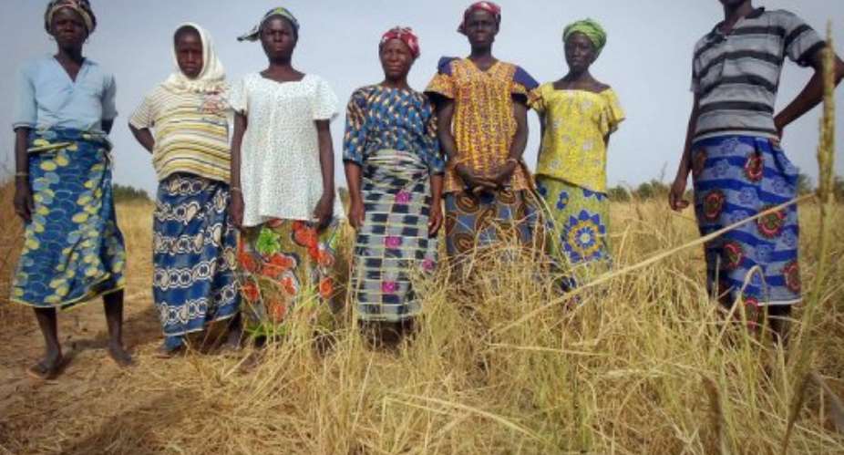 An Oxfam photo shows women in a rice field in a drought-hit part of Burkina Faso.  By Irina Fuhrmann (AFP/Oxfam/File)