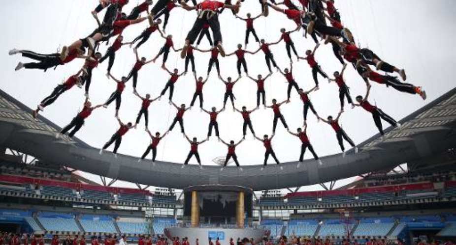 Students from Tagou martial arts school perform during a rehearsal of the opening ceremony of the 2014 Youth Olympic Games in Nanjing, eastern China's Jiangsu province, on August 9, 2014.  By  AFPFile