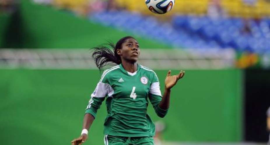 Asisat Oshoala of Nigeria watches the ball descend during the FIFA Women's U-20 Final against Germany at Olympic Stadium on August 24, 2014 in Montreal, Quebec, Canada.  By Richard Wolowicz GettyAFPFile