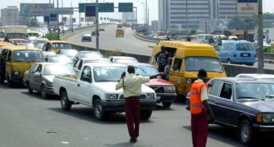 About 1,000 students took to the Third Mainland Bridge today to oppose the planned name Moshood Abiola University.  By Pius Utomi Ekpei (AFP)