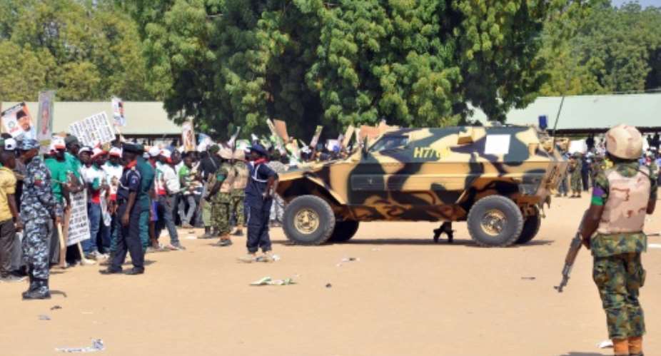 Soldiers and security block a road in Maiduguri, Nigeria on January 24, 2015.  By Tunji Omirin AFPFile
