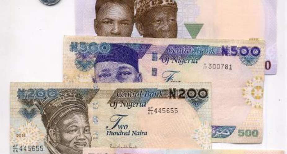 Nigeria is to revert to paper banknotes, the country's central bank has announced, in a policy switch bucking a growing trend around the world for tougher polymer-based currency..  By Pius Utomi Ekpei AFPFile