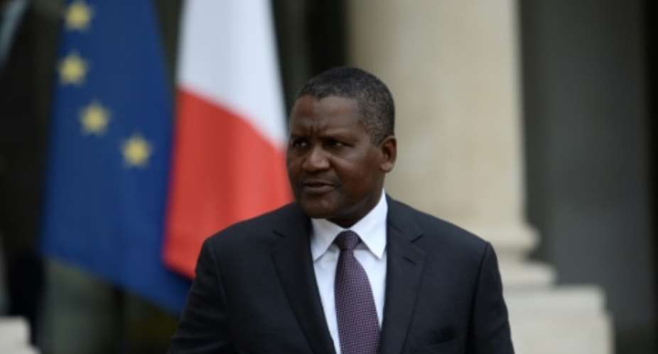 Nigerian billionnaire Aliko Dangote: 'There are ups and downs'.  By STEPHANE DE SAKUTIN AFP