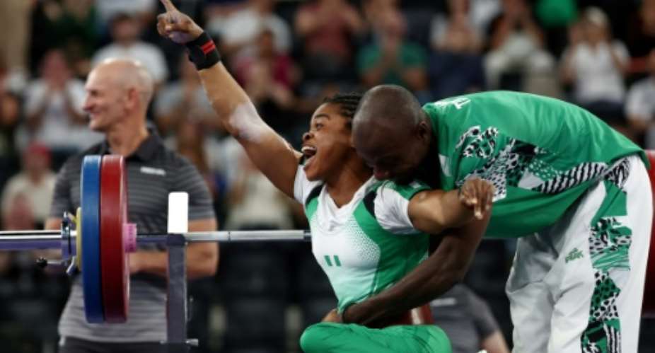Nigerian Esther Nworgu was overjoyed after winning the silver medal in the womens powerlifting 41kg final.  By FRANCK FIFE (AFP)