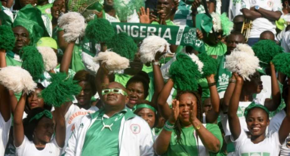 Nigerian fans cheer for their team in November 2016.  By PIUS UTOMI EKPEI AFPFile