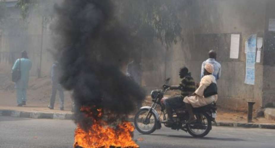 There has been widespread opposition in Nigeria to the ending of fuel subsidies.  By Pius Utomi Ekpei (AFP)