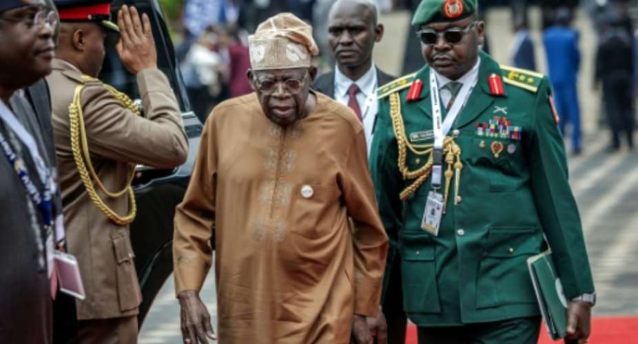 Nigerian President Bola Tinubu (C) announced more than 13,000 terrorists had been killed in the past year.  By Luis TATO (AFP/File)