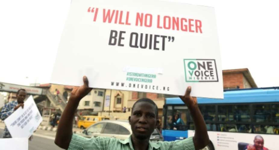 Nigerian protesters say 'enough is enough' over the country's economic crisis.  By PIUS UTOMI EKPEI AFP