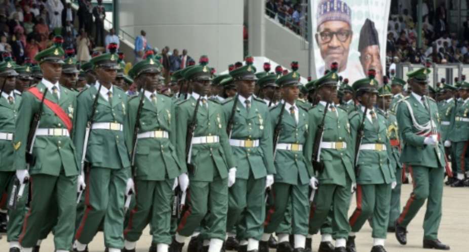 Nigerian soldiers march during the inauguration of President Mohammadu Buhari at Eagles Square in Abuja, on May 29, 2015.  By Pius Utomi Ekpei AFP