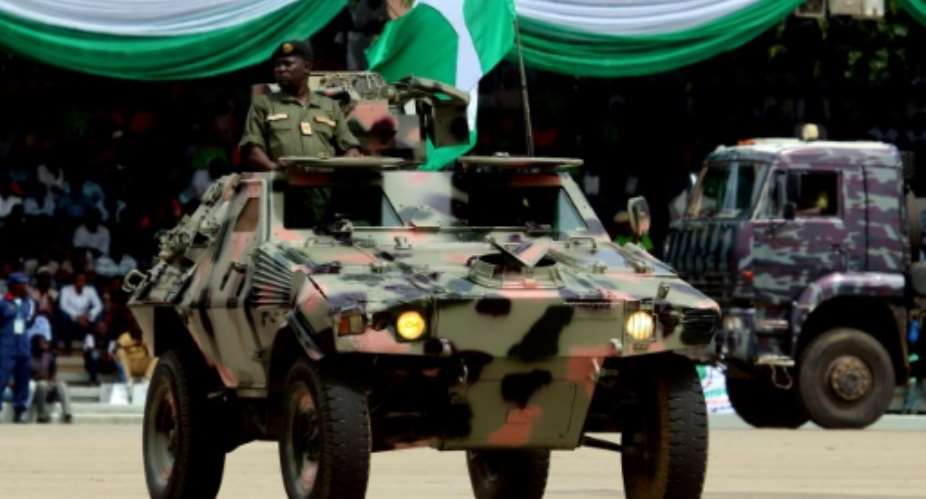 Nigeria's army, seen here parading vehicles, confirmed eight troops had been killed in a militant attack over the weekend.  By Sodiq ADELAKUN AFP