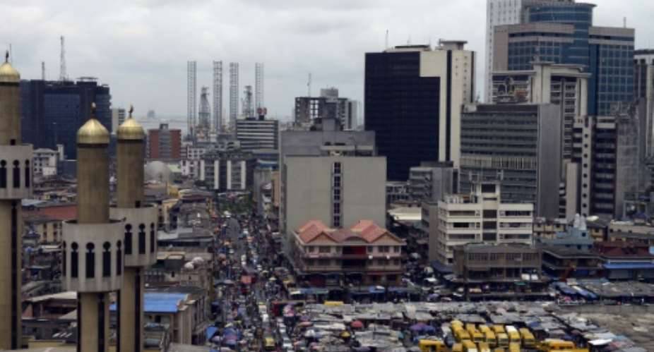 Nigeria's economy continued its recovery from recession, rising 1.4 percent in the third quarter of this year on increased oil production, official data showed.  By PIUS UTOMI EKPEI AFPFile