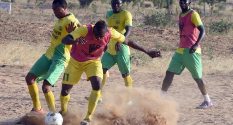 Players of El Kanemi Warriors FC train on a sandy pitch in Maiduguri, on February 2, 2016.  By Pius Utomi Ekpei AFPFile